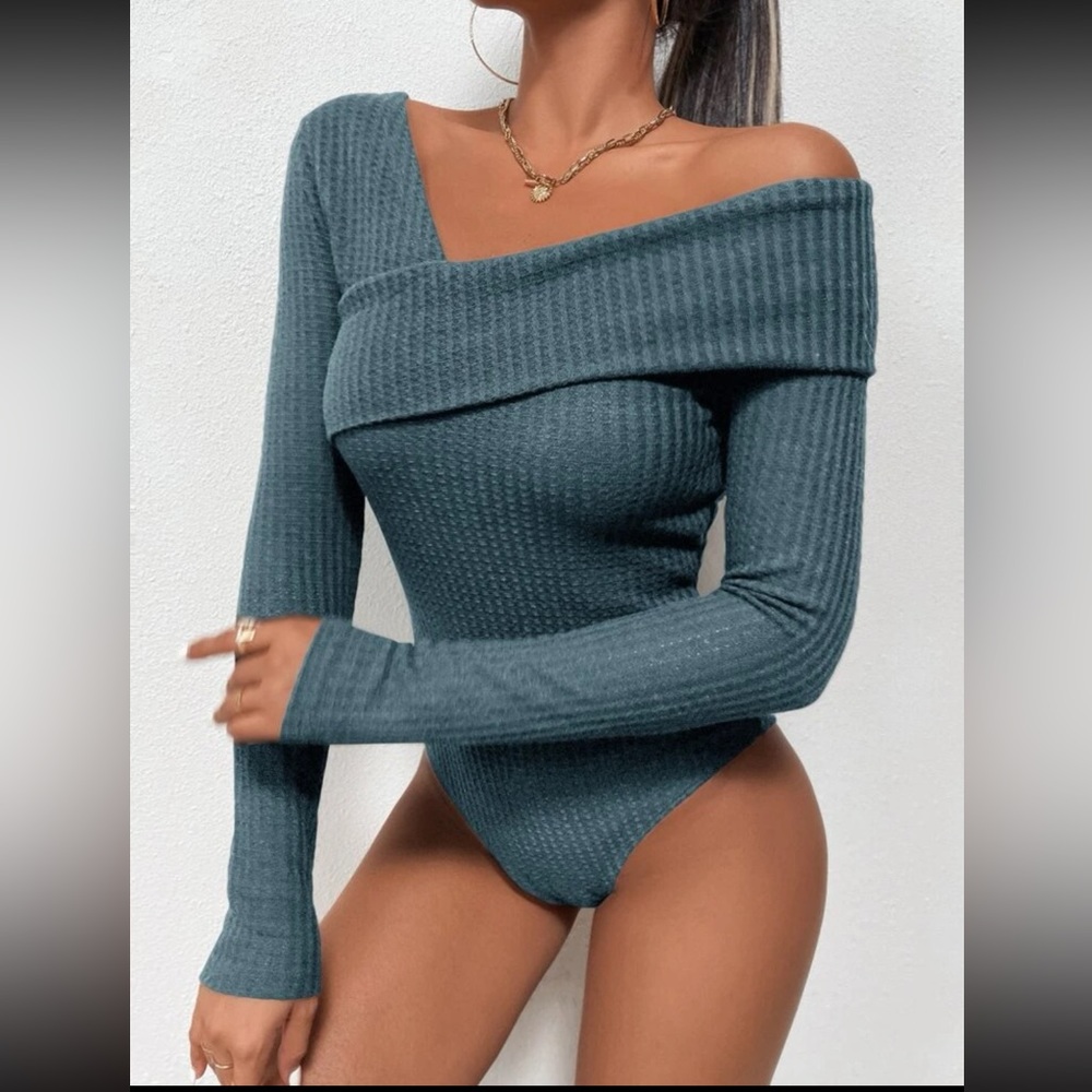 Asymmetrical blue knit body suit! Adorable top.